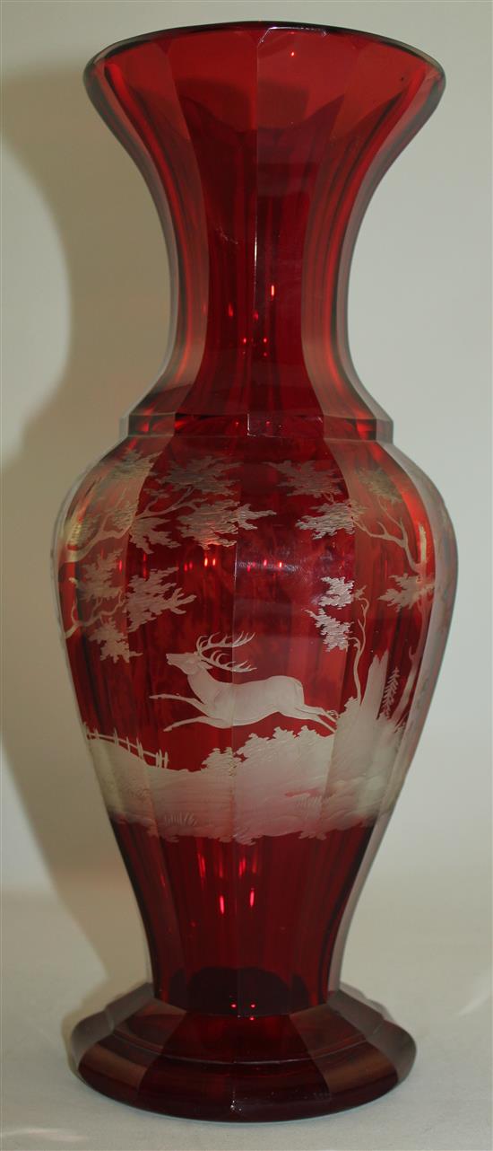 A Bohemian ruby glass multi-facetted baluster vase, late 19th century, 31.5cm